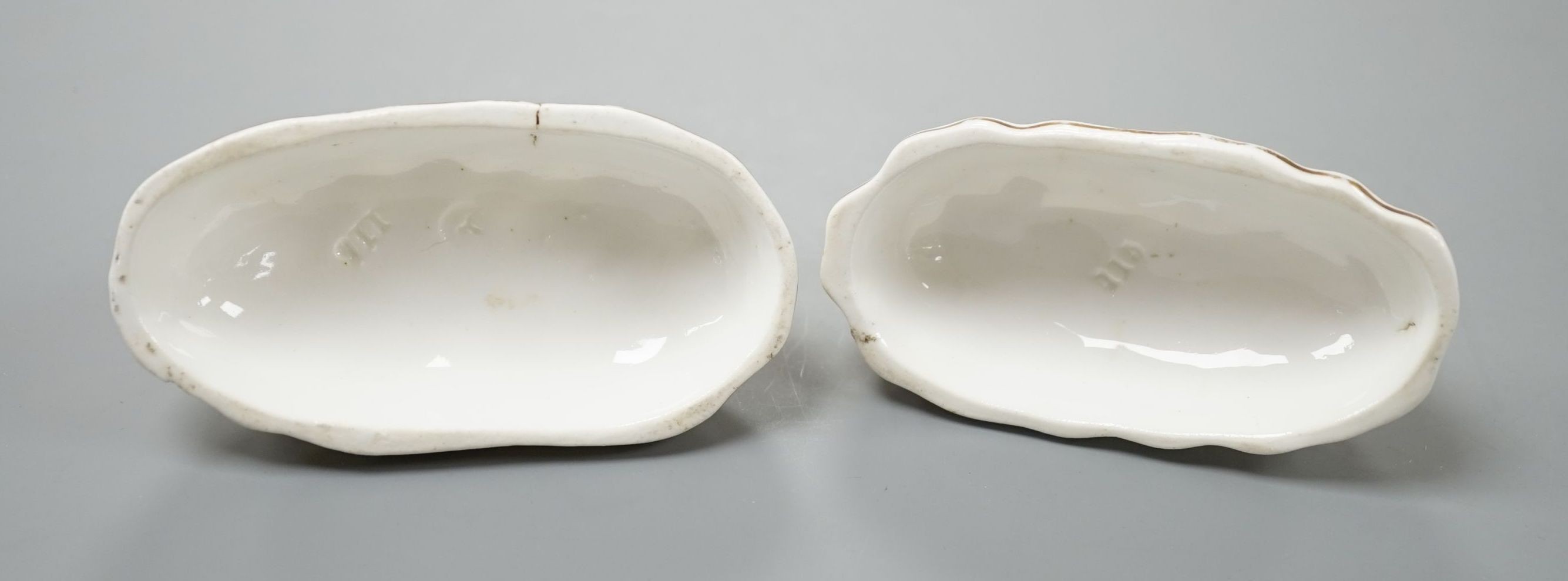 A rare pair of Samuel Alcock porcelain models of recumbent pointers, c.1835–50, impressed mark ‘115’, 8.8 cm long, Unrecorded in Dennis G.Rice Dogs in English porcelain., Provenance: Dennis G.Rice collection